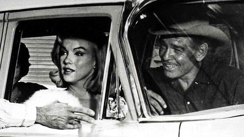 Marilyn Monroe and Clark Gable in a car together