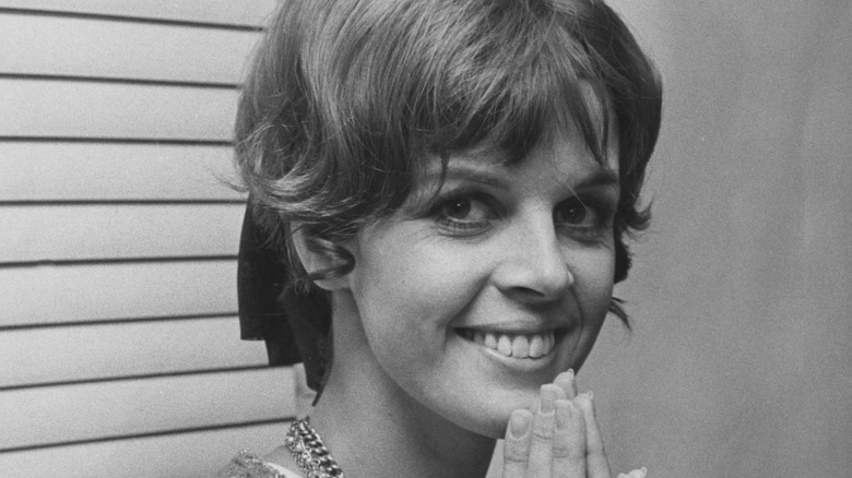 Claudine Longet smiling hands on chin