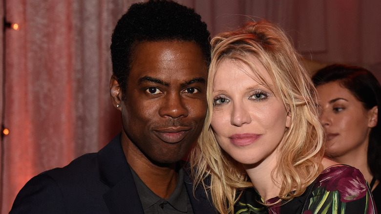 Chris Rock embracing Courtney Love