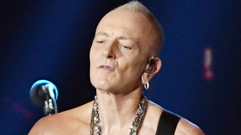 Phil Collen performing with Def Leppard