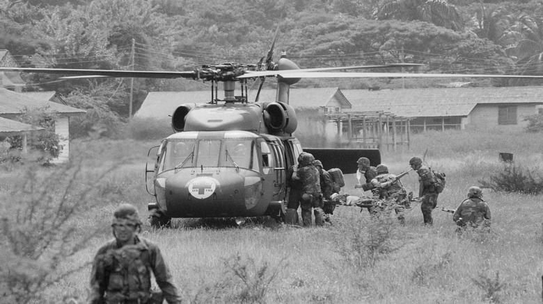 Soldiers evacuting casualty during Grenada