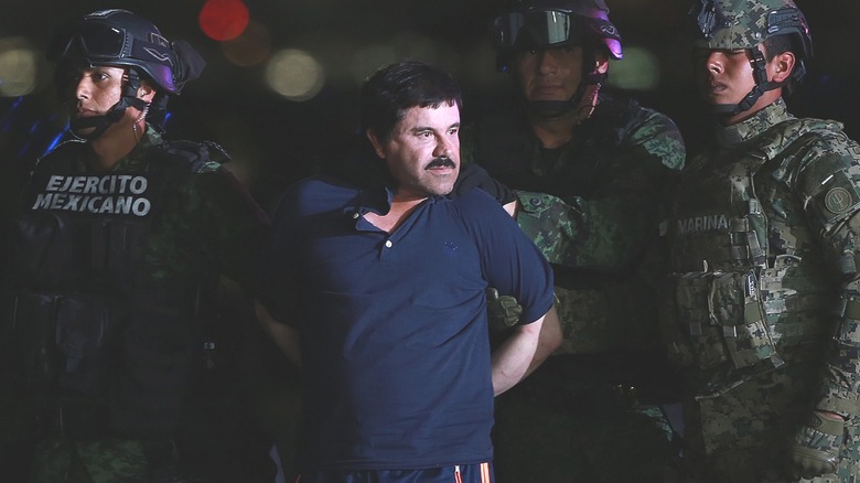 El Chapo handcuffed with authorities