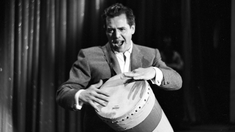 desi arnaz playing a drum