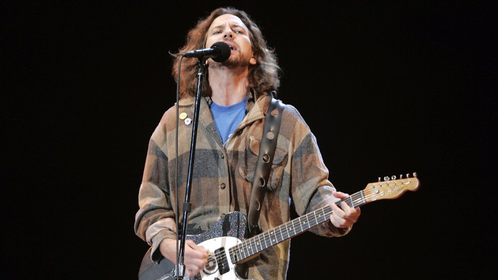 Eddie Vedder on stage mic guitar singing