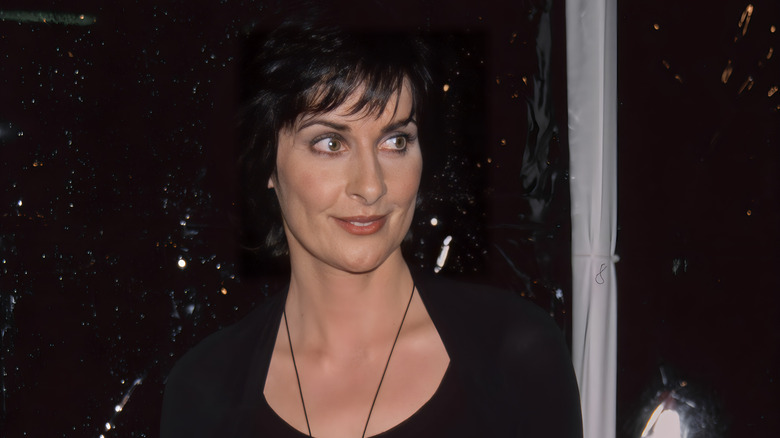 Enya black dress smiling