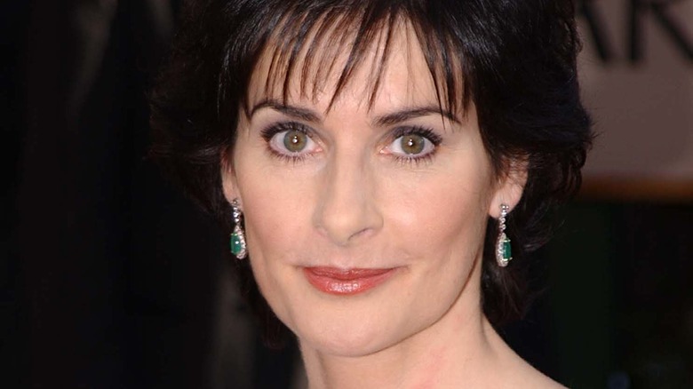 Enya smiling big earrings