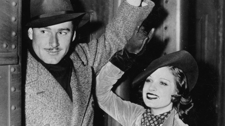 errol flynn and lili damita smiling