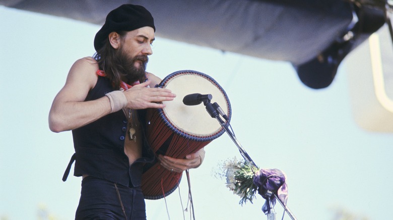 Mick Fleetwood playing drum on stage 