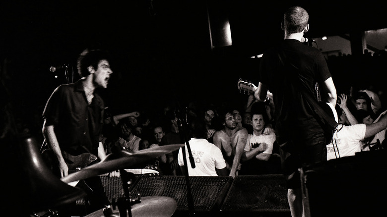 Guy Picciotto and Ian MacKaye onstage