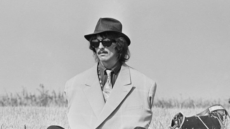 George Harrison in a field in 1967