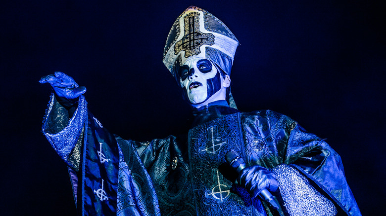 Papa Emeritus face paint priest costume on stage