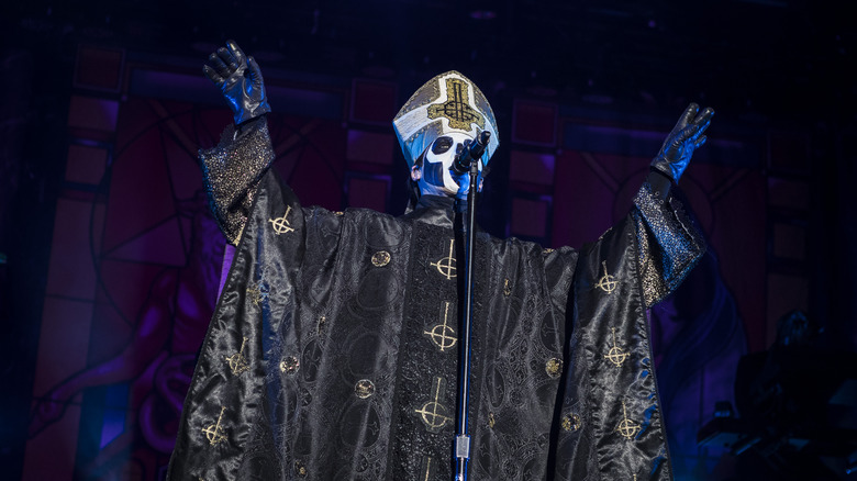 Papa Emeritus face paint priest costume on stage