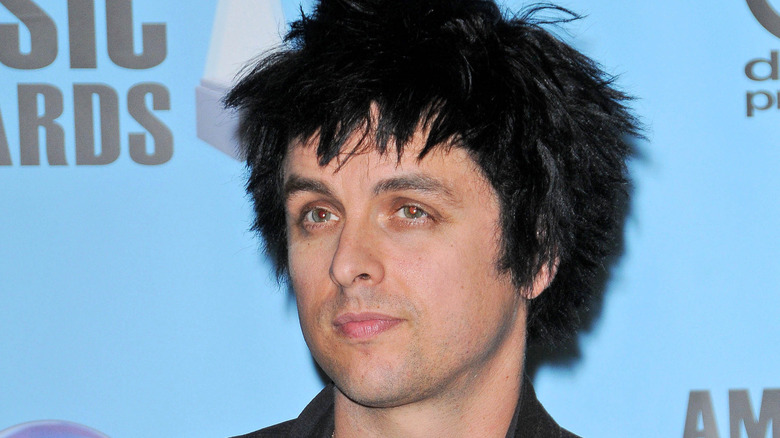 Billie Joe Armstrong of Green Day smirking
