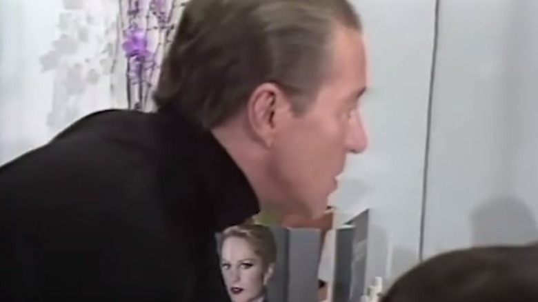 Halston hair slicked back