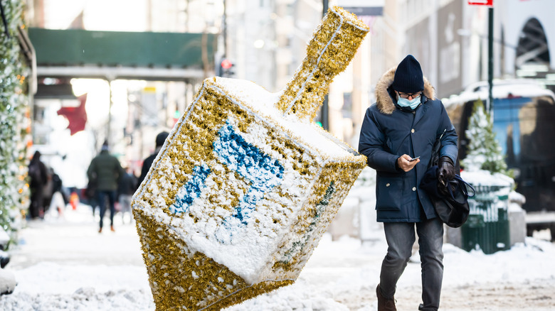 a giant dreidel in the snow