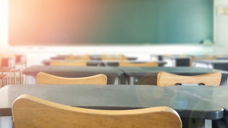 Empty classroom with desk and chairs