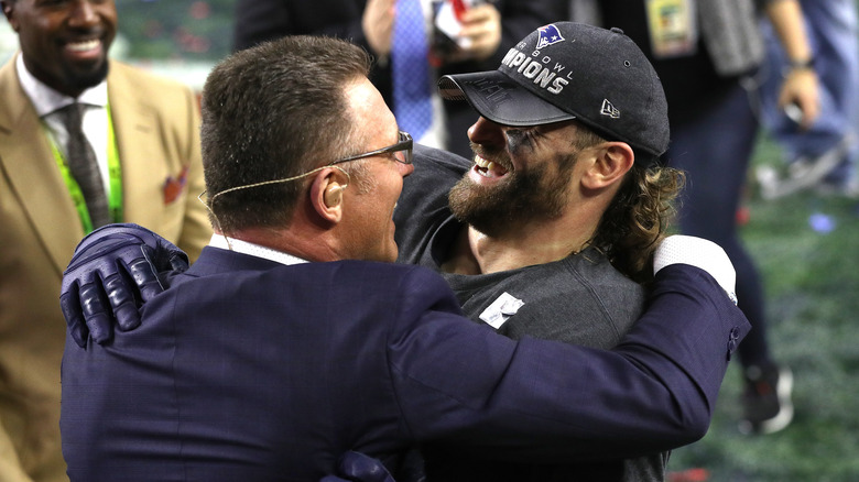 Howie Long celebrating with son, Chris