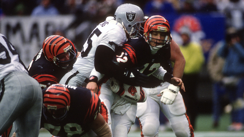 Howie Long tackling Donald Hollas 