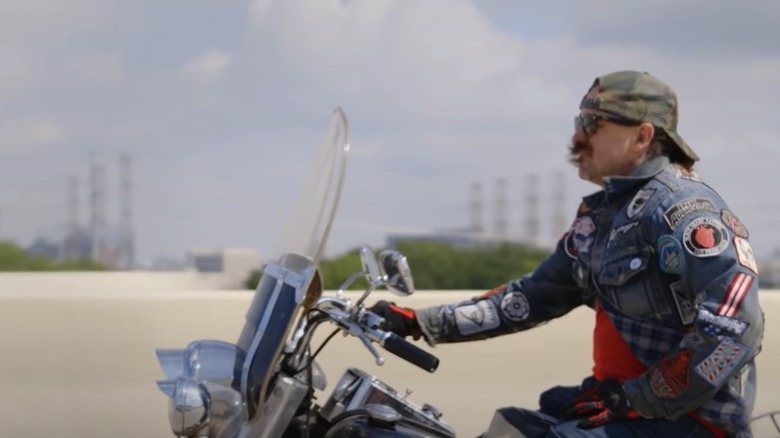 Oliver Peck riding motorcycle