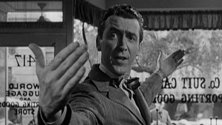 George Bailey (Jimmy Stewart) goes suitcase shopping