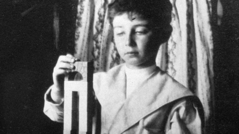 Oppenheimer playing with wooden blocks