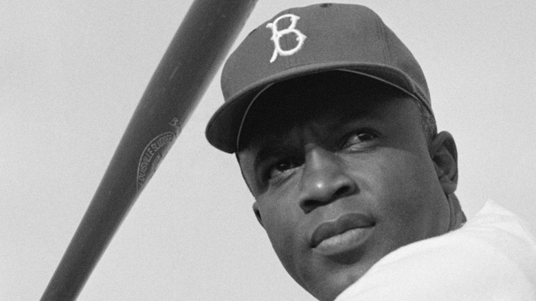 Jackie Robinson holding a bat