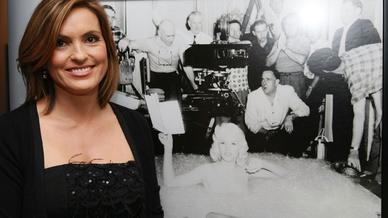 Mariska Hargitay smiling next to photo of Jayne Mansfield