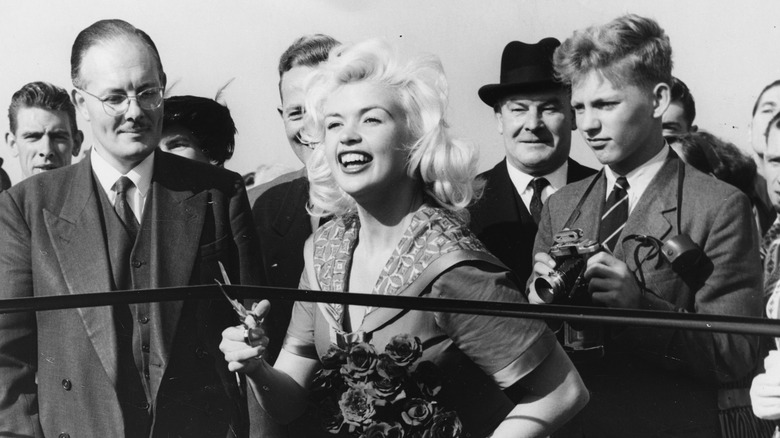 Jayne Mansfield cutting the tape at an event