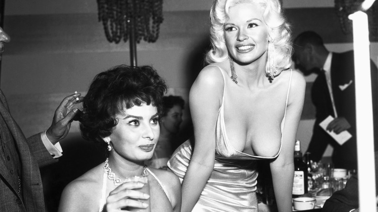 Jayne Mansfield posing above Sophia Loren