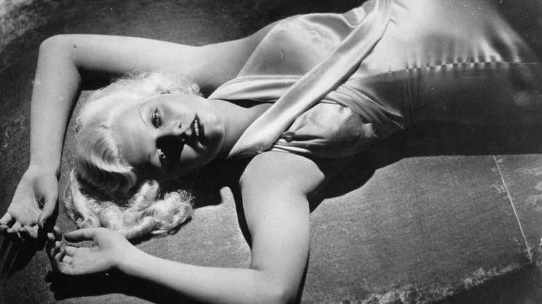 Jean Harlow laying down and posing