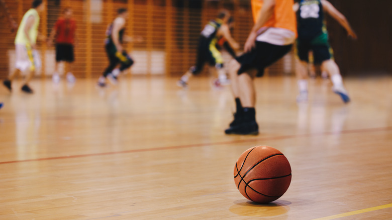 Young men playing basketball