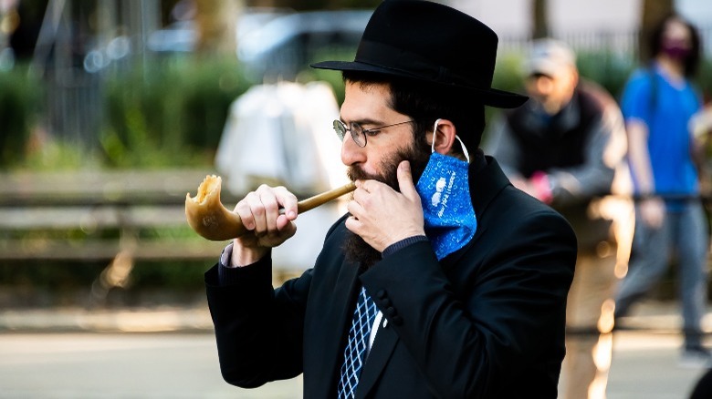 Rabbi blowing a shofar