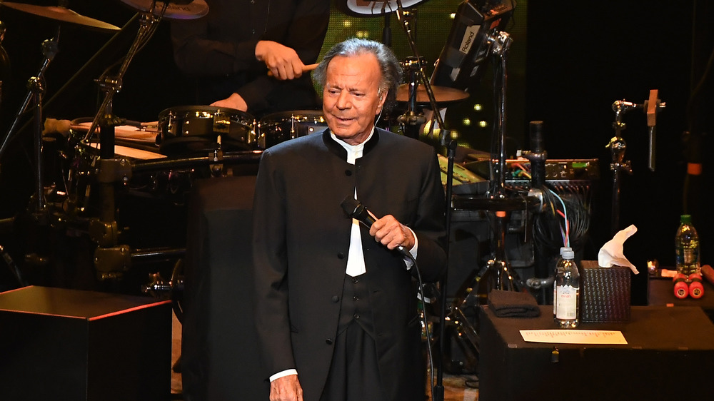 Julio Iglesias smiling with mic