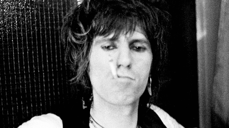 Keith Richards smokes a cigarette