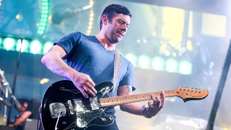 Wes Borland playing guitar on stage