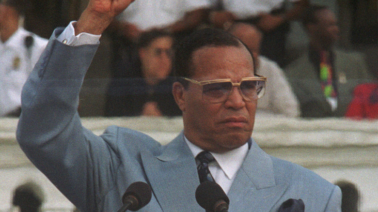 Louis Farrakhan with hand raised