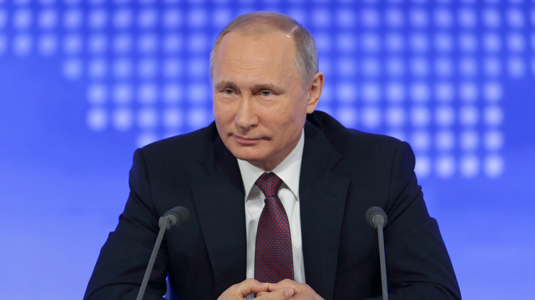 Vladimir Putin smirking