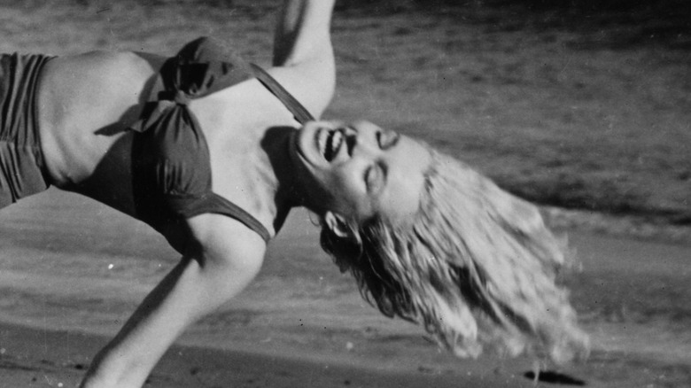 Monroe frolicking on a beach