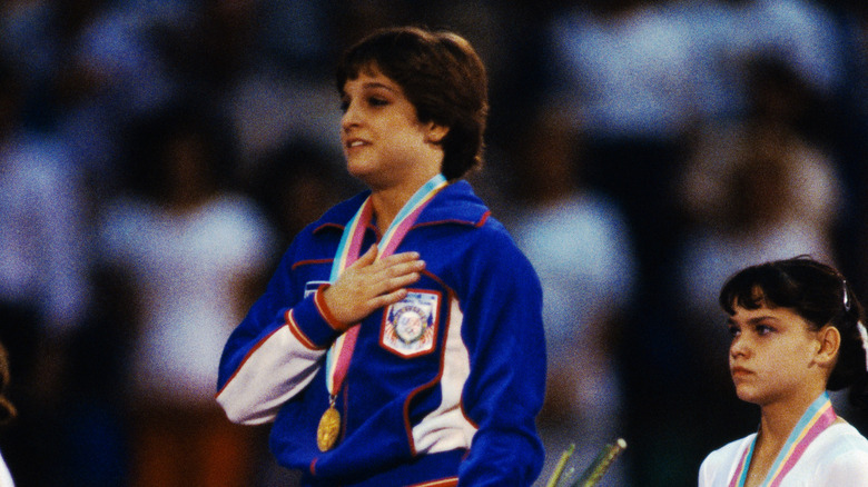 Retton hand on heart podium gold medal 