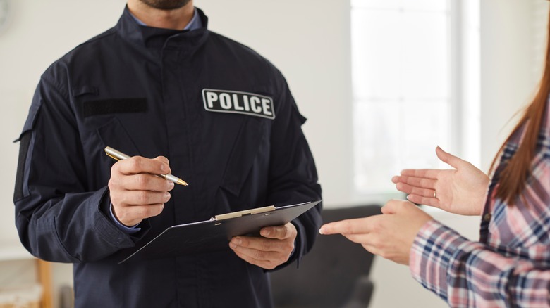 Woman talking to police officer