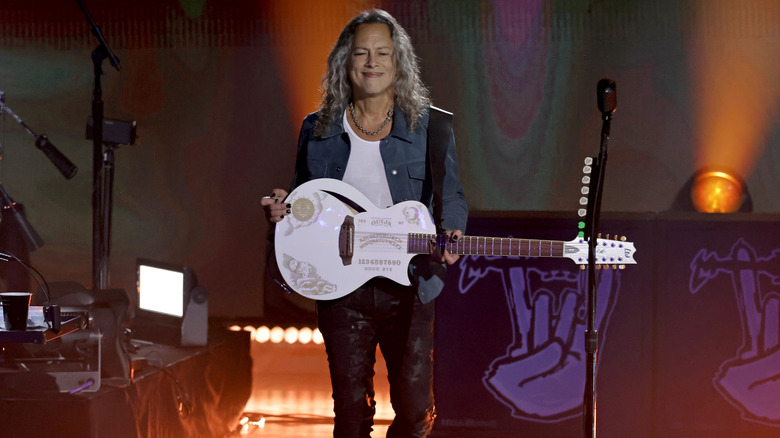 Kirk Hammett holding white guitar