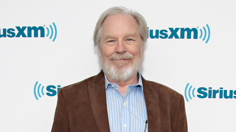 Bearded Michael McKean smiling