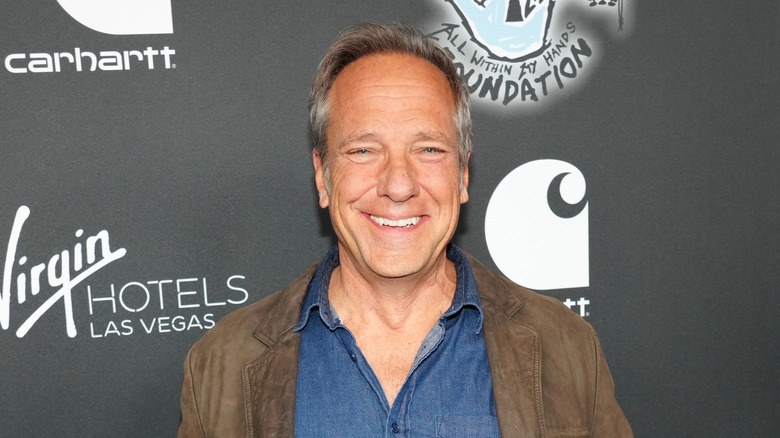 Mike Rowe smiles outside concert