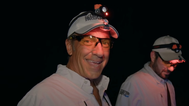 mike rowe night beige uniform headlamp smiling