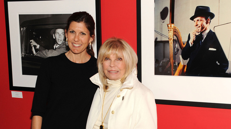 Amanda Erlinger and Nancy Sinatra posing and smiling