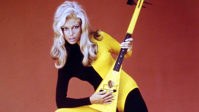 Nancy Sinatra posing with guitar