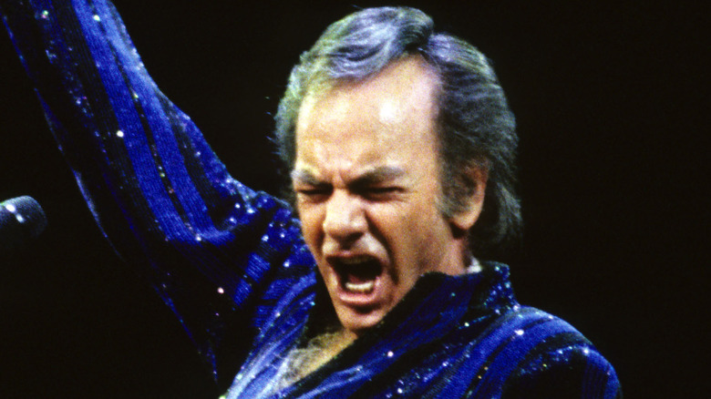 neil diamond blue striped shirt screaming on stage