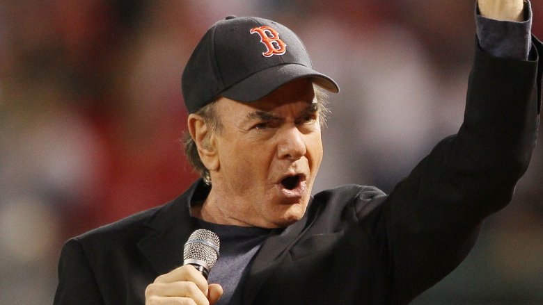 Neil Diamond baseball cap mic arm raised