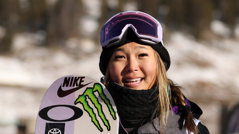 Chloe Kim with snowboard