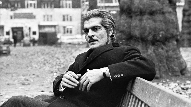 Omar Sharif in a black suit